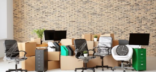 Office move – furniture and electronics office furniture being moved