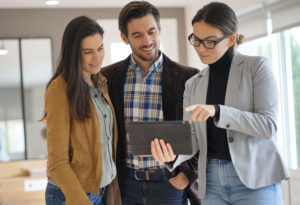real estate agent with clients
