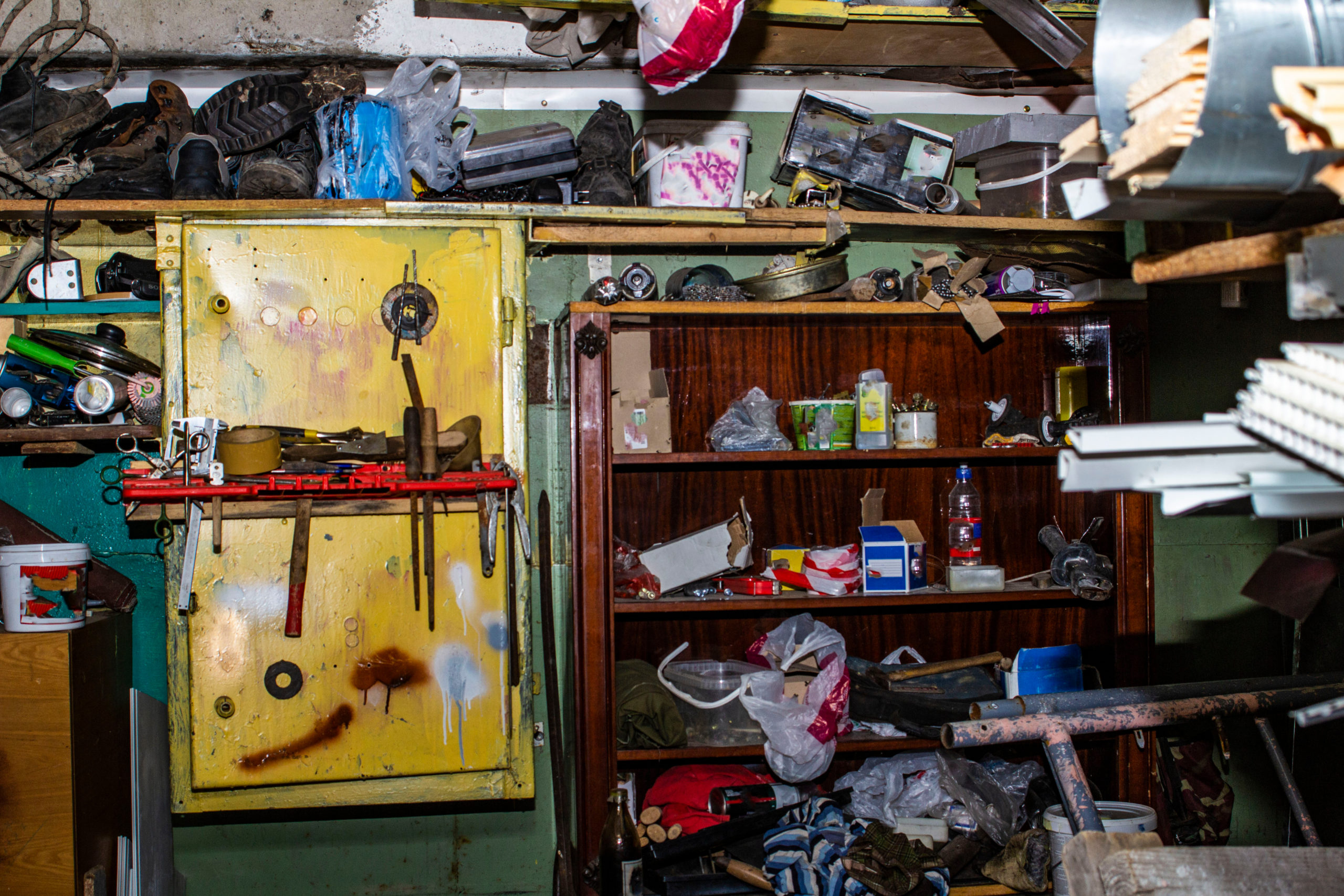 A cluttered garage full of junk