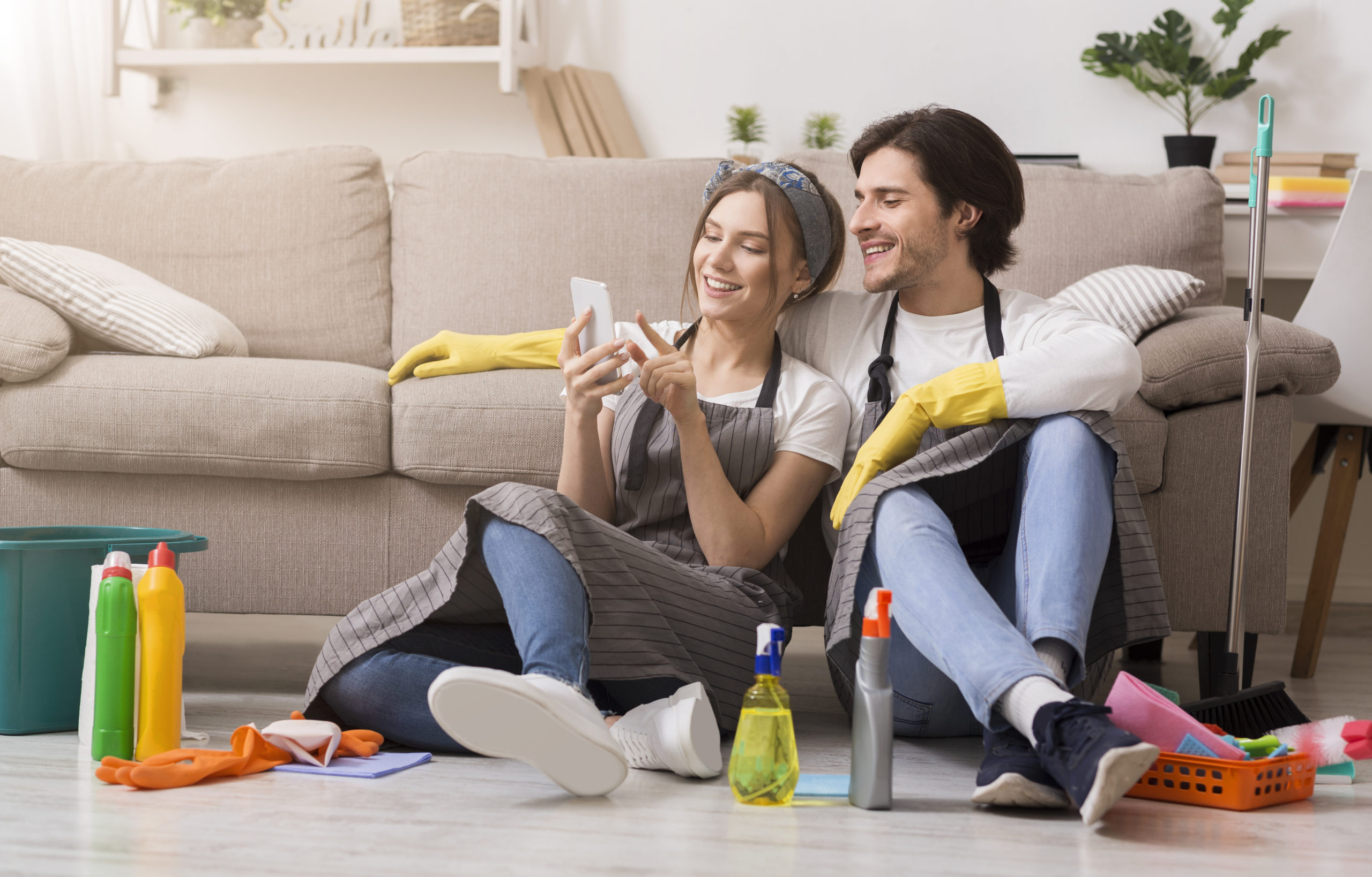 A couple taking a break from spring cleaning