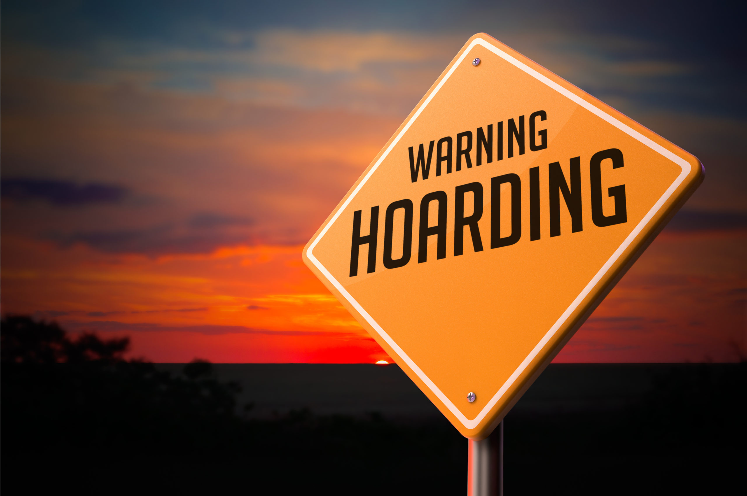 A hoarding warning sign