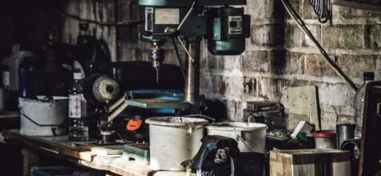 Garage table with many different tools on it